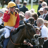 Ryan Moore and Snow Fairy after winning the Oaks Epsom 04.06.2010