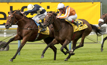 Danedream (Andrasch Starke) collars Nathaniel (William Buick) to win the King George VI and Queen Elizabeth Stakes<br /><br /><br /> Ascot 21.7.12 Pic: Edward Whitaker