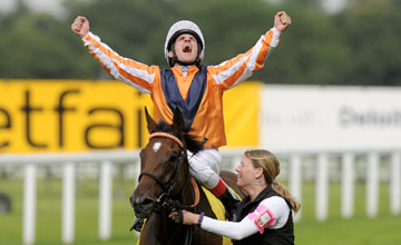 ASCOT, ENGLAND - JULY 21: Andrasch Starke riding Danedream win The King George VI and Queen Elizabeth Stakes at Ascot racecourse on July 21, 2012 in Ascot, England. (Photo by Alan Crowhurst/Getty Images)