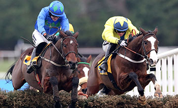 Hurricane Fly and Ruby Walsh jump the last upsides Our Conor when winning the Grade 1
