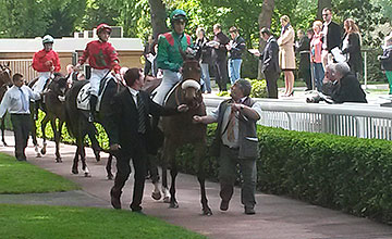 Shamkala returns to the winner's enclosure after the 1m2f fillies' race at Longchamp