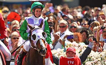 MELBOURNE, AUSTRALIA - NOVEMBER 03: Michelle Payne is congratulated by her brother Steven Payne, who has Down syndrome and works as a strapper after Michelle Payne riding Prince Of Penzance won race 7 the Emirates Melbourne Cup on Melbourne Cup Day at F